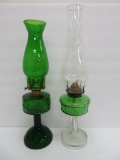 Two oil lamps, green glass