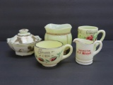 Five pieces of vintage custard glass and souvenirs