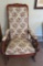 Grape and Cable carved back rocker with rose upholstered back and arms