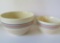 Two blue and pink banded mixing bowls, 9
