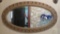 Ornate oval wall mirror, 47