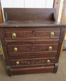 Spoon carved three drawer commode with back splash