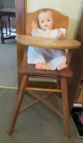 1950's wooden high chair with decals and vintage baby doll