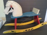 Wood and moulded plastic rocking horse, lamb stencil on rockers