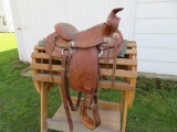 Nice leather tooled saddle, saddle stand, 14
