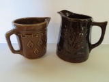 Two stoneware pitchers