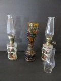 Three miniature oil lamps, 10