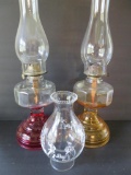 Two oil lamps, colored bases, 18