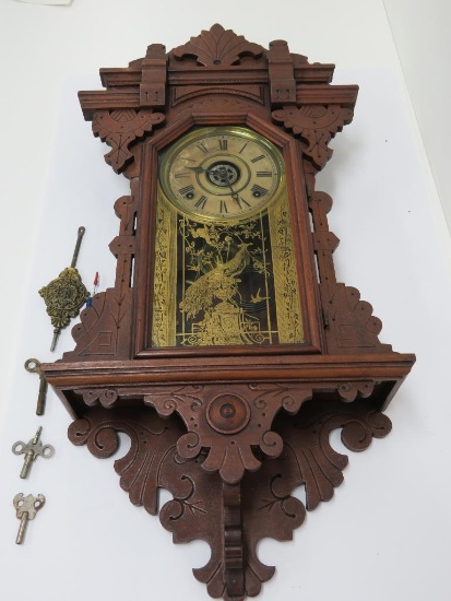 Ornate carved case wall clock, 29" tall