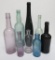 8 Assorted Colored bottles, all unmarked, 6