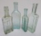 Four Healing and Pain Oil bottles, aqua, 5