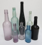 8 Assorted Colored bottles, all unmarked, 6