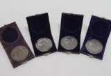 Four cased Waukesha souvenir coins