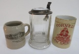 Three advertising mugs and steins