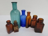 Seven colored medicine bottles