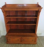 Carved bookcase with two drawers