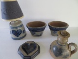 Five pieces of Rowe Pottery, lamps and planters