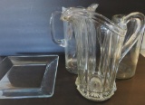 Three glass pitchers and serving plate, 8