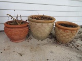 Three terra cotta style planters