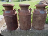 Three metal milk cans, Raw Milk, rust noted