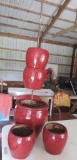 Five pottery planters with rebar rod for stacking display