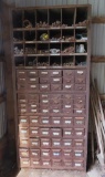 Large metal multi drawer cabinet filled with fasteners