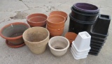 Assorted clay and plastic planters