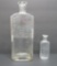 Two H D Sykes Pharmacist Milwaukee bottles, clear, 10