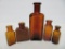 Five amber medicine bottles, 2 1/2