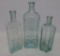 Three aqua medicine bottles, Cherry Phosphate, Sarsaparilla and Pepto Mangan, 7