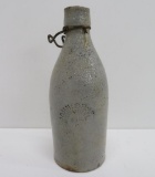 John Graf Stoneware bottle, grey, chips on rim noted. 8