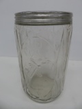 Hoosier Sellers cabinet style jar with woman and rolling pin embossed design, 7