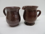 Two Redware cream pitchers, 4 1/2