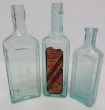 Three aqua and green remedy Bottles, 7