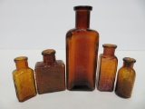 Five amber medicine bottles, 2 1/2