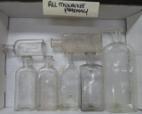 Seven Milwaukee Pharmacy Bottles, clear, 4