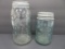 Two aqua Mason Jars, quart and pint with bug mark