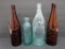 Four vintage West Bend beer bottles, Lithia and HM Lochen