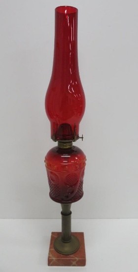 Ruby and amber glass oil lamp on marble pedestal, 22 1/2"