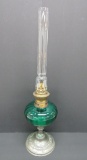 Unique oil lamp with teal colored font and pewter base, 18