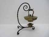 Wrought iron and brass M B & Co tea kettle with holder, 15