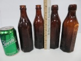 Four amber brown Graf Bottles, 8