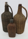 Three wicker reed covered bottles