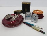 Vintage smoking lot with ashtrays, lighters and retro pens