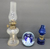 Two miniature oil lamps and St Clair paperweight