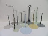 12 metal doll stands, 7