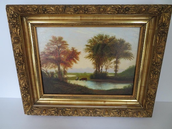 Ornate framed oil painting of cows in river