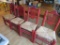Four heavy rush seat chairs, red