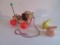 Fisher Price Little Snoopy Pull Toy and two vintage plastic rabbit rattles