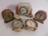 Five vintage alarm clocks, pink